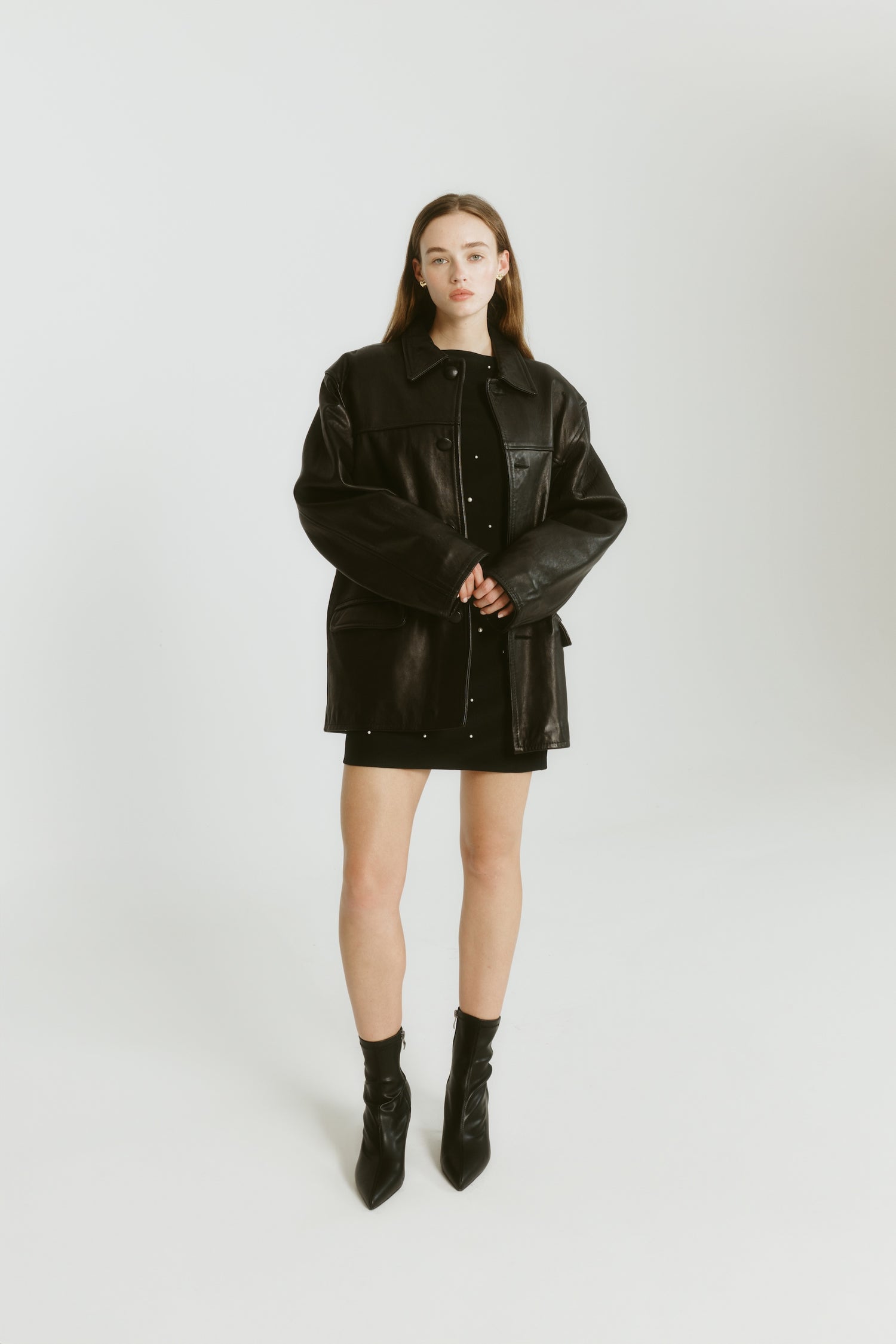 Womens black ankle sock boot with stiletto heel and pointed toe