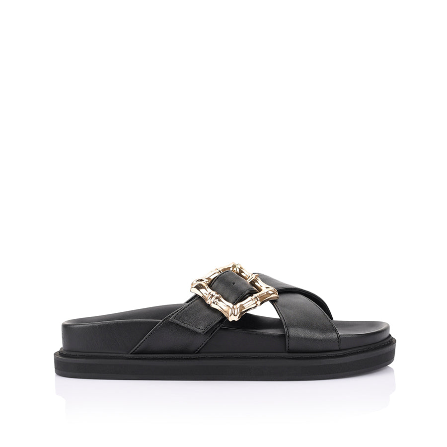 Women's black footbed slides with gold buckle