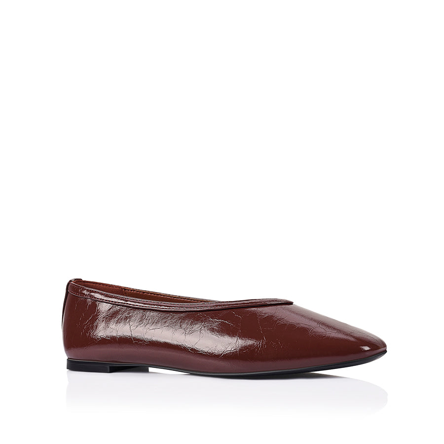Burgundy flat with square toe shape and v high vamp