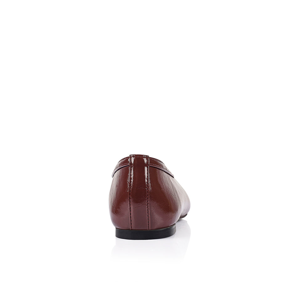 Burgundy flat with square toe shape and v high vamp