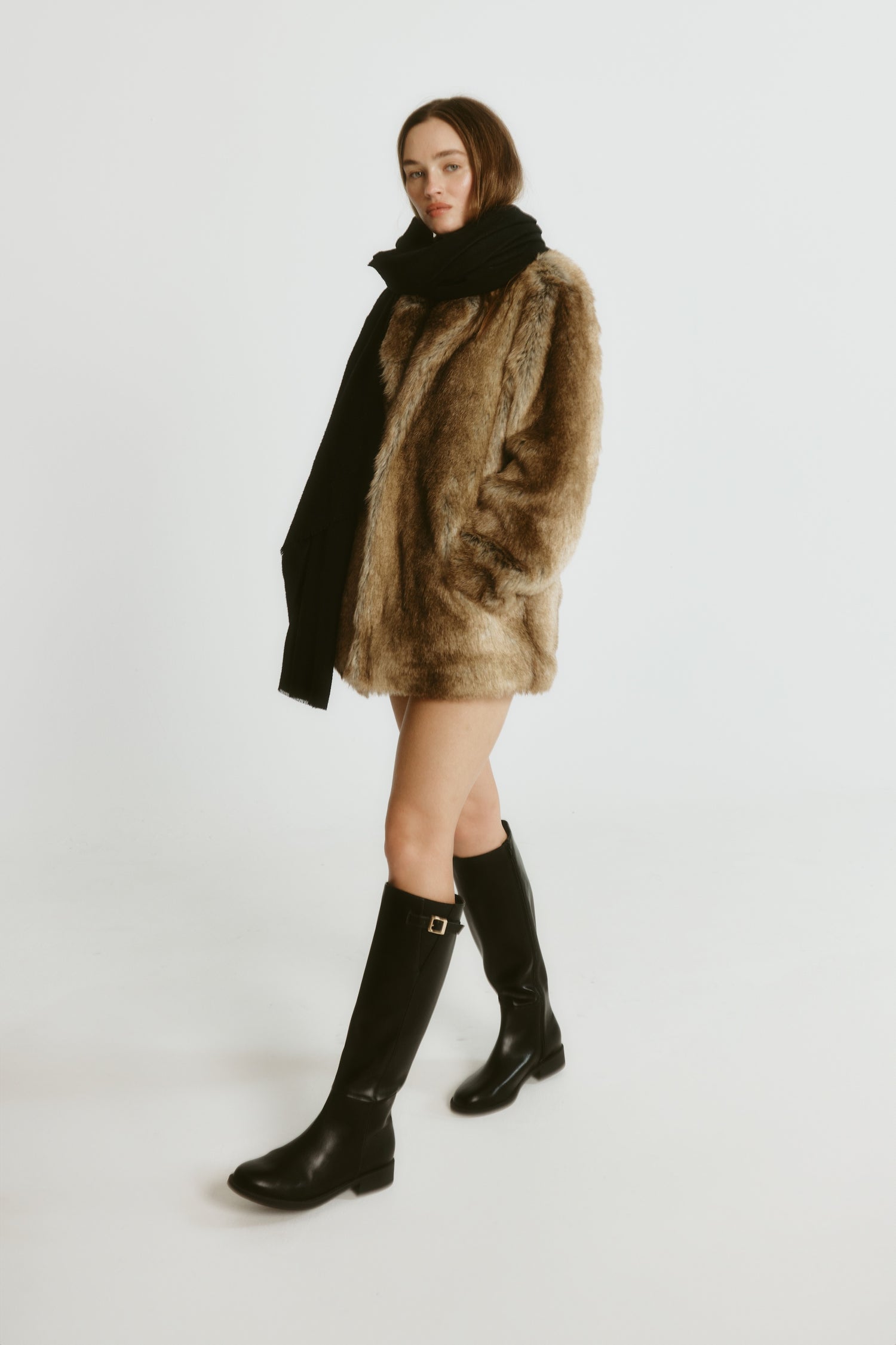 Women's knee high flat riding boots with elastic gusset and gold buckle detail