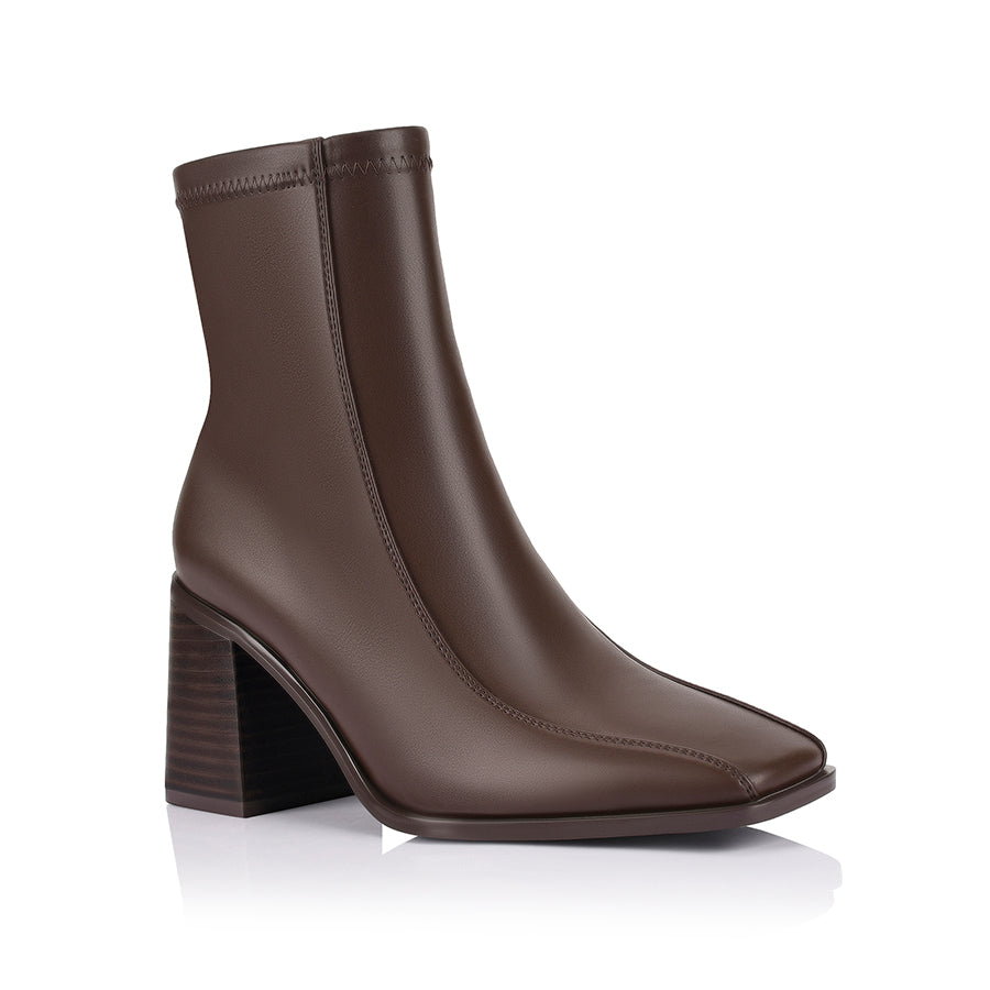 Brown ankle boot with a block heel with a square toe shape and zip closure
