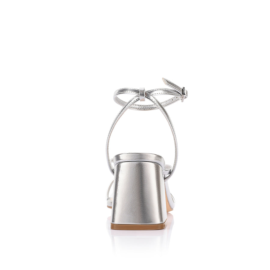 Silver high-heeled sandal on a block heel with a square toe shape
