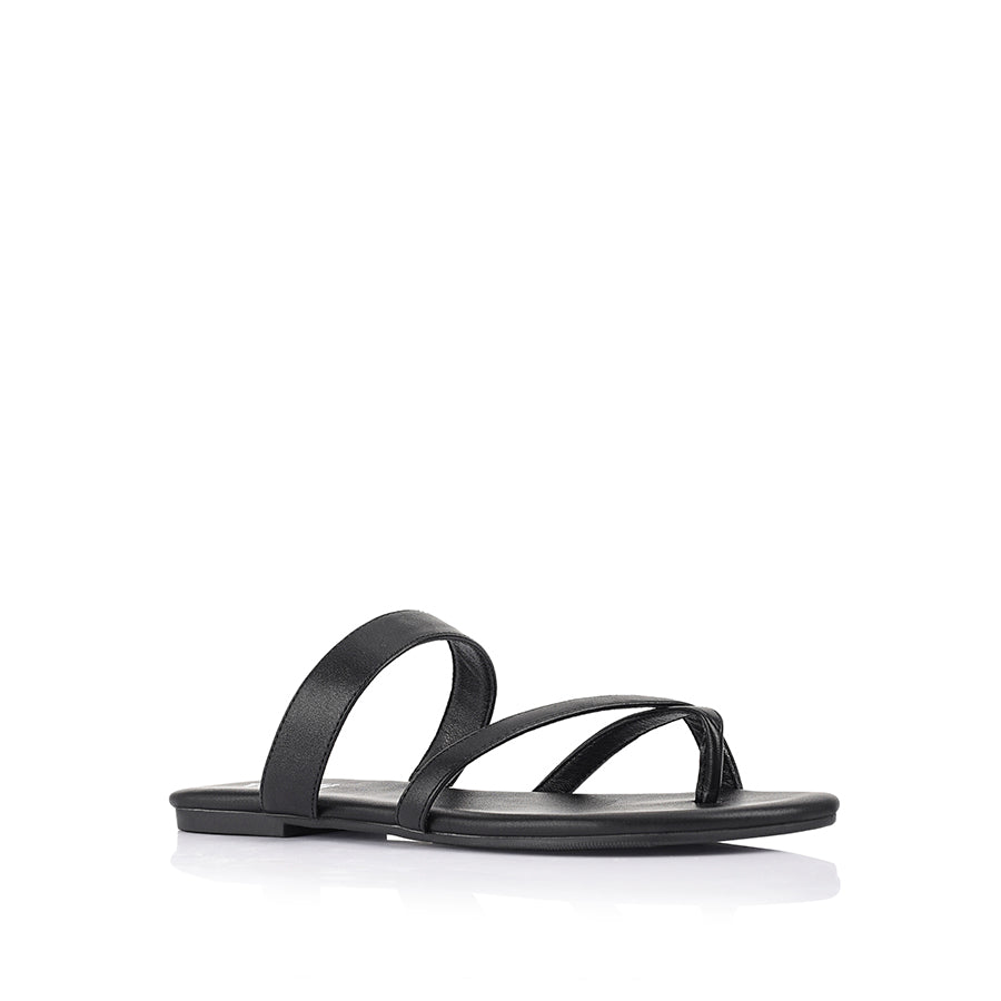 Women's black flat sandal with crossover straps and toe ring