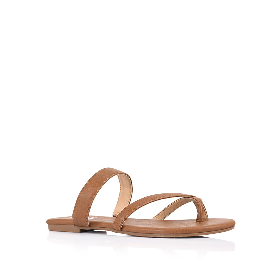 Women's vegan tan flat sandal with crossover straps and toe ring
