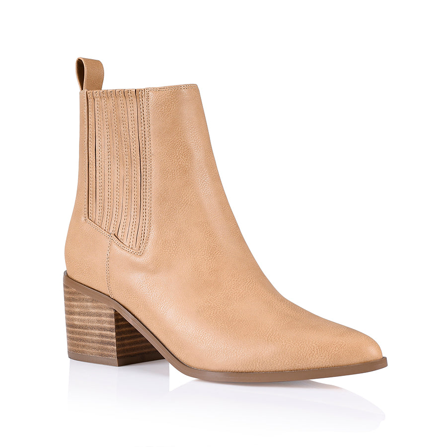 A caramel-colored ankle boot with an elastic side gusset and a smooth almond-shaped toe, set against a white background.