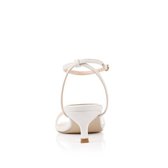 White square toe sandal with a kitten heel and an adjustable strap