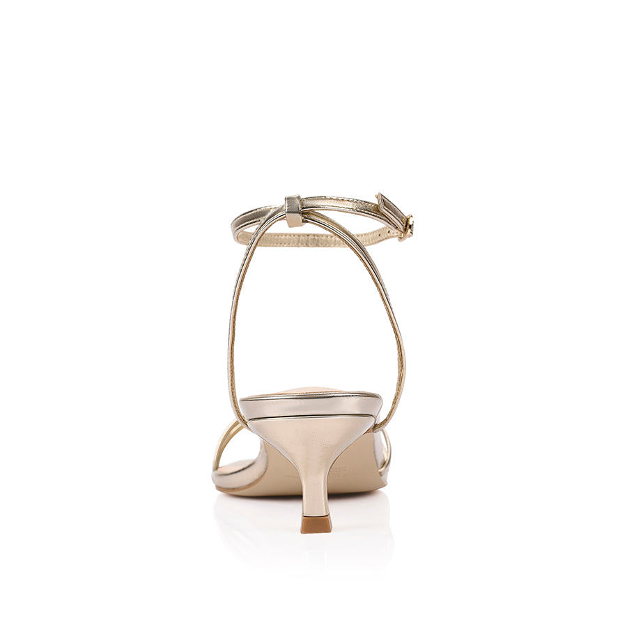 Gold square toe sandal with a kitten heel and an adjustable strap