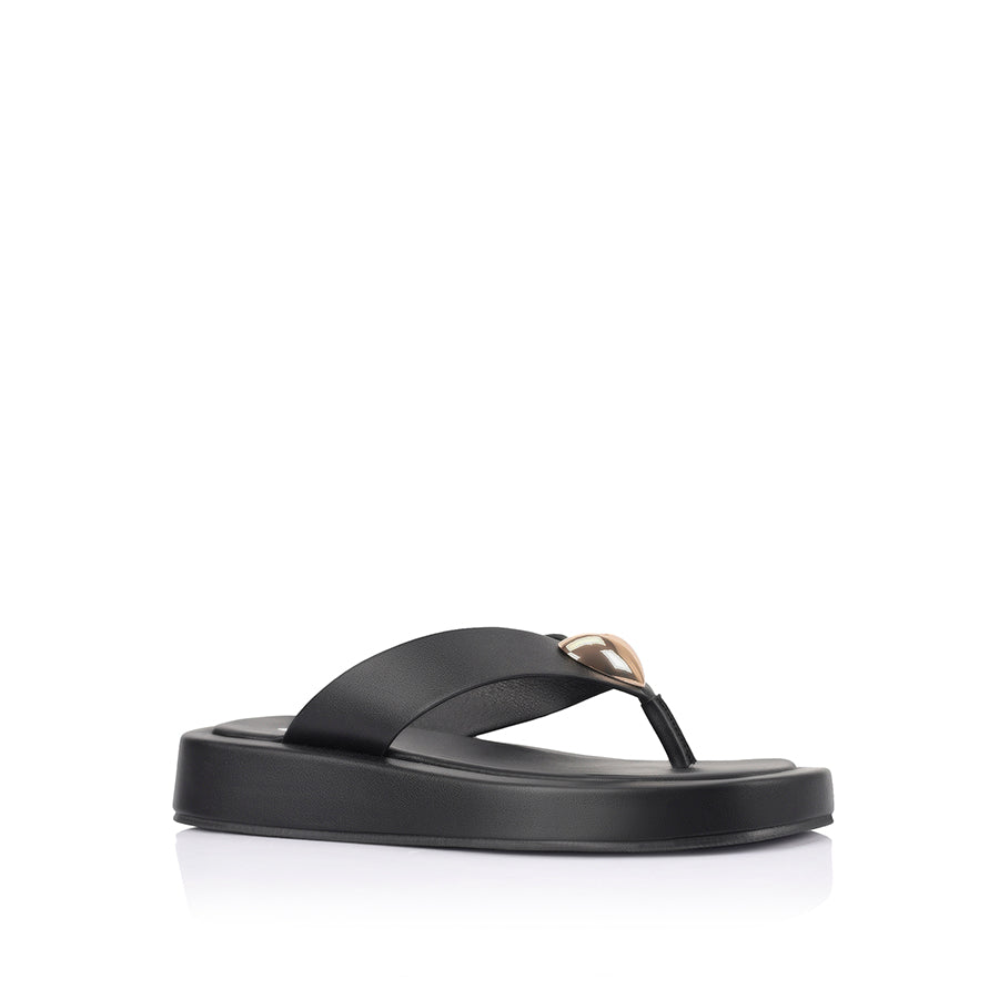 Women's black vegan platform thong with gold heart embellishment 