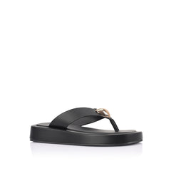 Women's black vegan platform thong with gold heart embellishment 