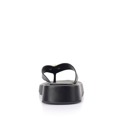 Women's black vegan platform thong with gold heart embellishment 