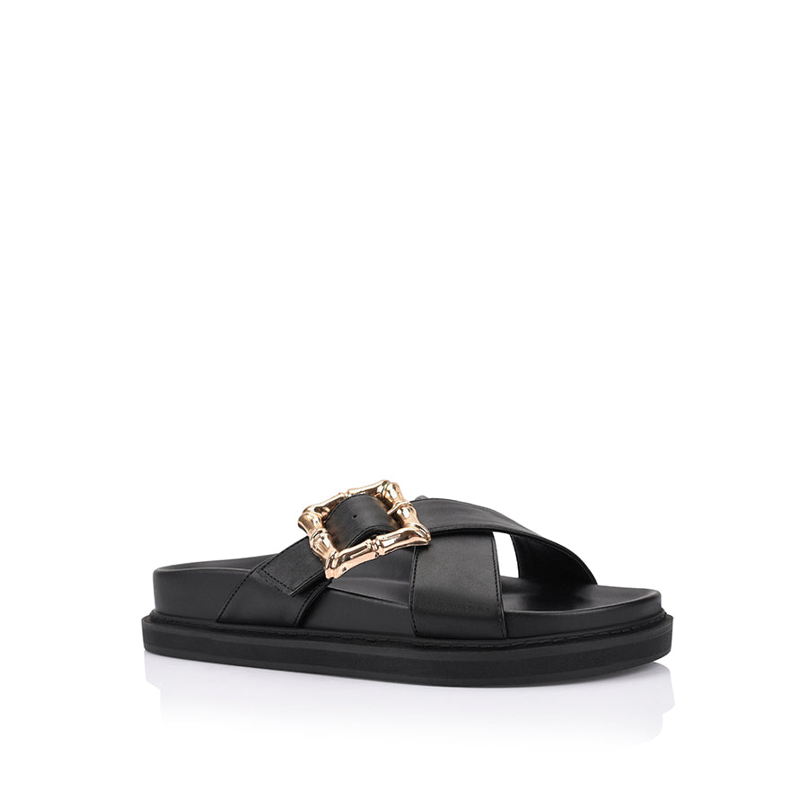Women's black footbed slides with gold buckle