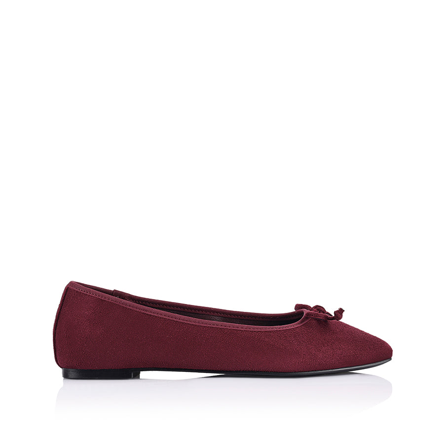 Burgundy microsuede ballet flats with a black heel and small bow