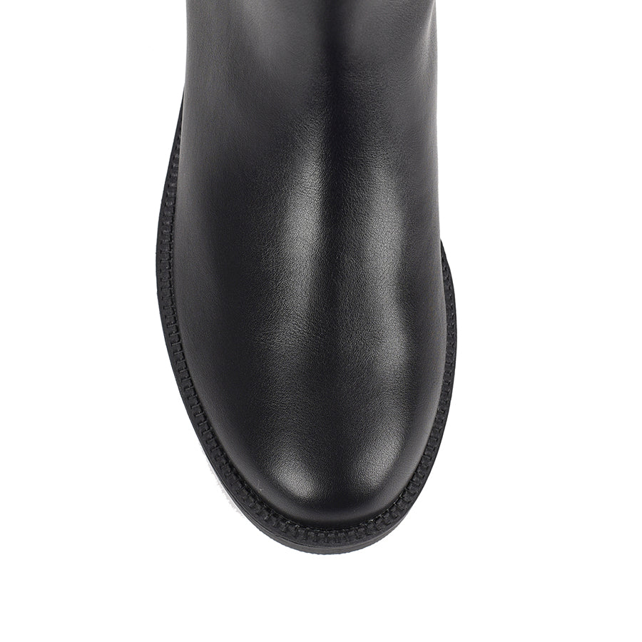 Women's wide calf flat knee high riding boot in black vegan leather