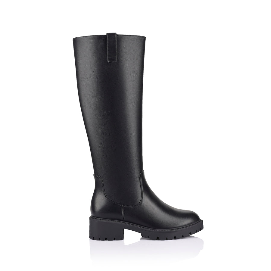 Black knee-high boot on a a chunky sole