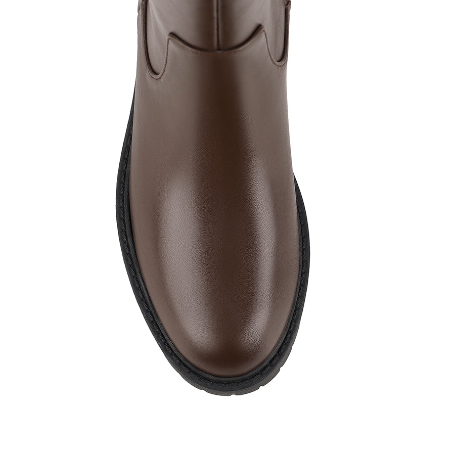 Brown knee-high boot on a a chunky sole