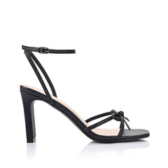 Women's black vegan strappy high heels, with thin straps, bow detail and buckle up ankle strap 