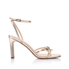 Women's champagne gold vegan strappy high heels, with thin straps, bow detail and buckle up ankle strap 