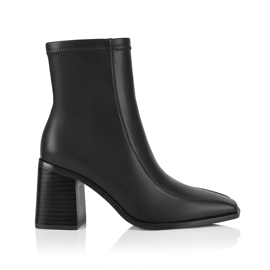 Brown ankle boot with a block heel with a square toe shape and zip closure