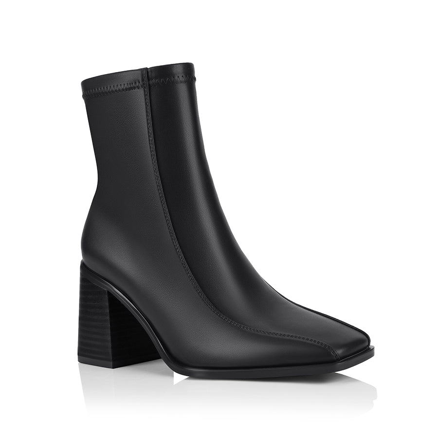 Brown ankle boot with a block heel with a square toe shape and zip closure