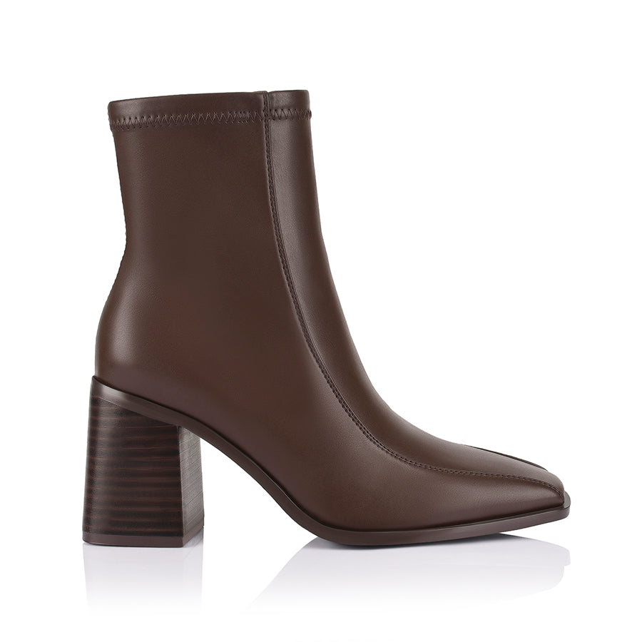 Brown ankle boot with a block heel with a square toe shape and zip closure