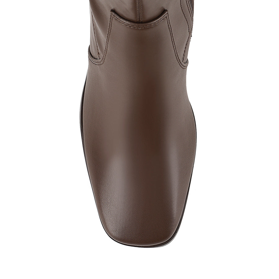 Brown knee high boots with zip closure