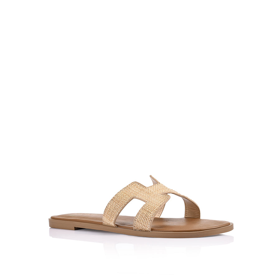 Women's flat slide sandal in tan vegan leather with natural raffia for summer