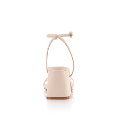 Women's strappy sandal with block heel, thin vamp straps, buckle on ankle strap and square toe in bone vegan material