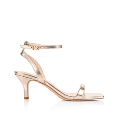 Women's metallic gold strappy low heel with ankle strap, square toe and gold buckle