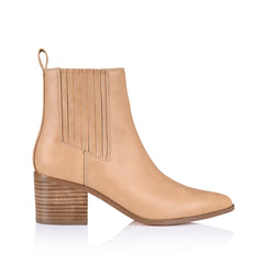 A caramel-colored ankle boot with an elastic side gusset and a smooth almond-shaped toe, set against a white background.
